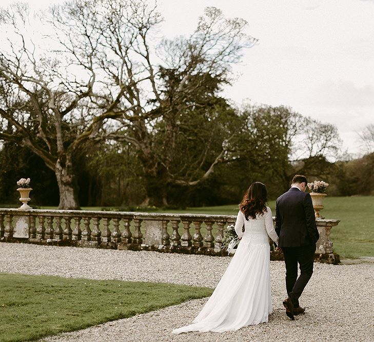 Bride in a Homemade Wedding Dress with Lace Bodice and Long Sleeves, and Groom in Navy Suit