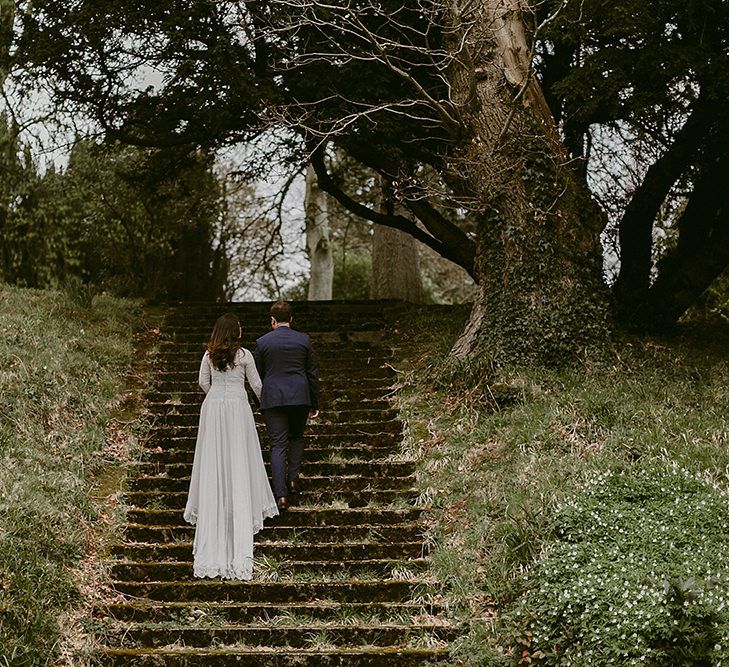 Bride in Homemade Wedding Dress with Lace Long Sleeves and High Neck