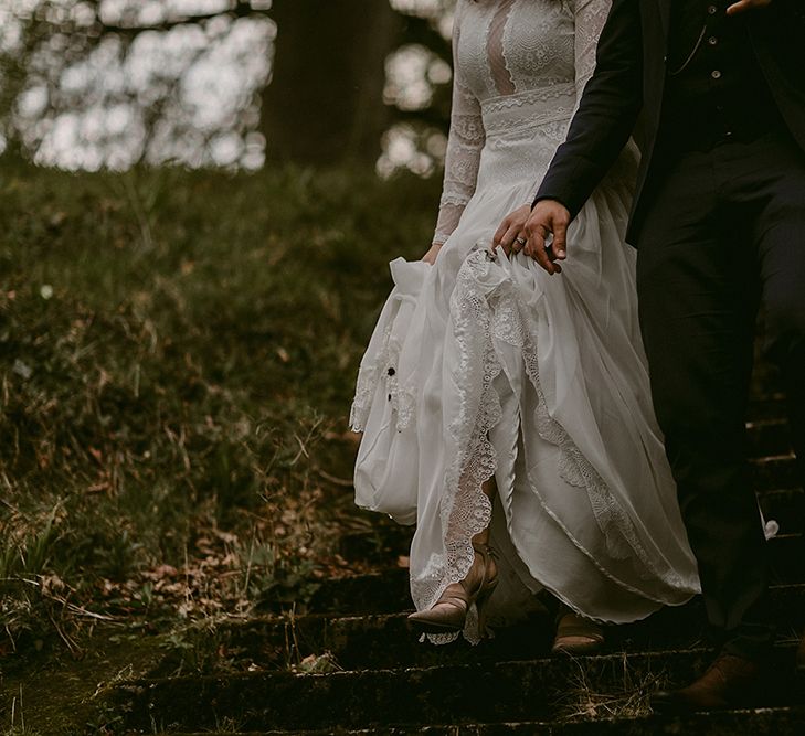 Bride in Homemade Wedding Dress with Lace Long Sleeves and High Neck