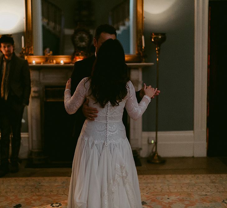 First Dance with Bride in Homemade Wedding Dress with Lace Long Sleeves and High Neck and Groom in Navy Zara Suit