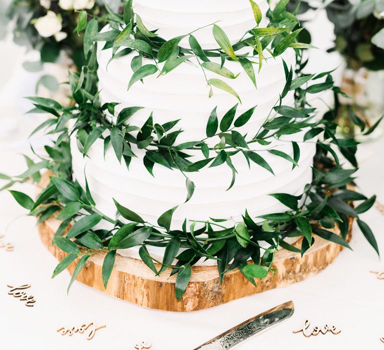 Wedding Cake With White Buttercream And Foliage