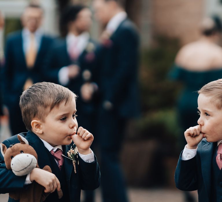 Twin Page Boys Sucking Their Thumb