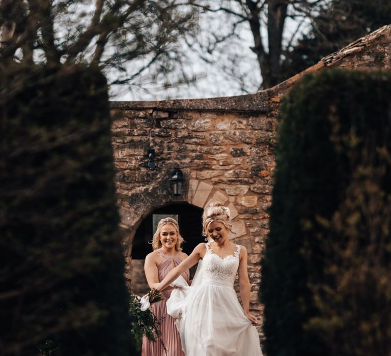 Bride in Stacey by Modeca Wedding Dress and Bridesmaids in Pink ASOS Dress