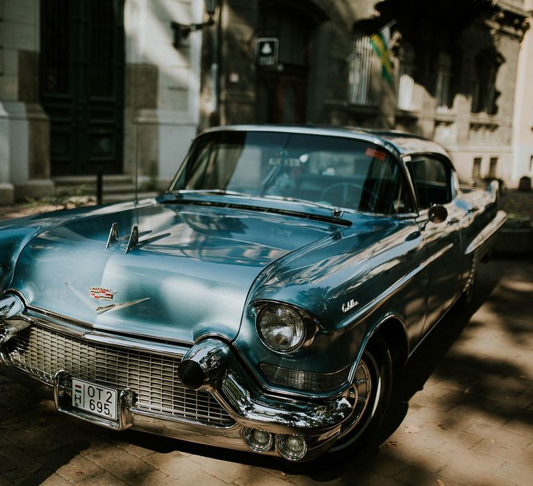 Vintage Blue Cadillac Wedding Transport | Budapest Wedding with Giant Bridal Bouquet, Tuk Tuks and Cadillac | Jágity Fanni Fotográfus