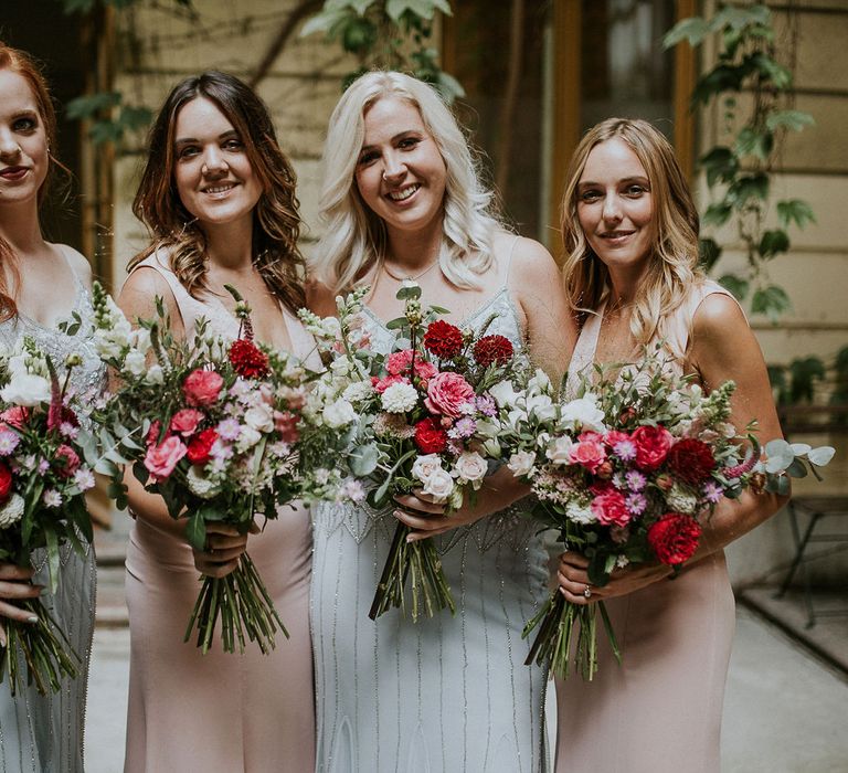 Bridesmaids in Blue Drop Waist Dresses with Spaghetti Straps and Beading | Bridesmaids in Pink V-Neck Dresses | Wedding Bouquets with Pink, Red and White Flowers and Foliage | Budapest Wedding with Giant Bridal Bouquet, Tuk Tuks and Cadillac | Jágity Fanni Fotográfus