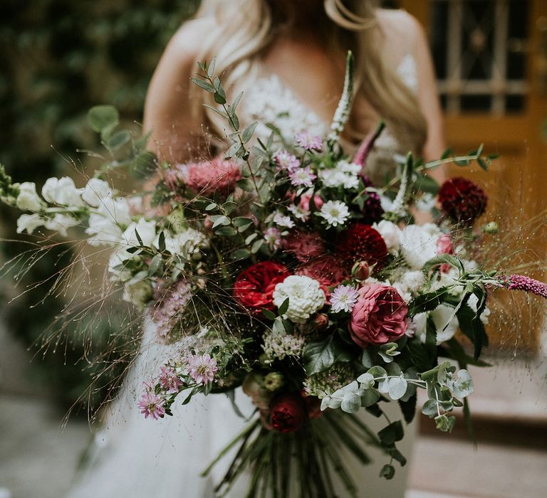 Bride in Lila Gown by Alexandra Grecco with Fitted Silk Crepe Skirt and Sheer Italian Tulle Bodice Covered in Floral Lace Applique | Oversized  Bouquet with Pink, Red and White Flowers and Foliage | Budapest Wedding with Giant Bridal Bouquet, Tuk Tuks and Cadillac | Jágity Fanni Fotográfus