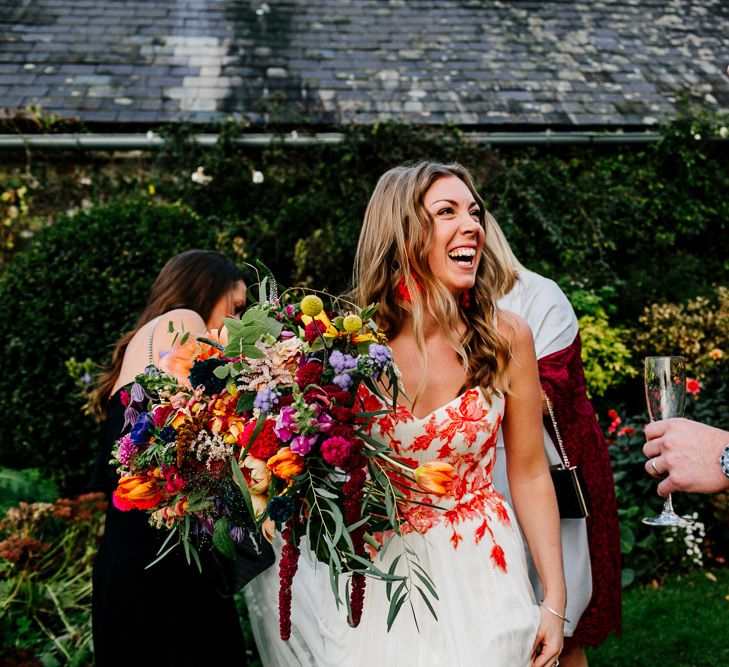 Bride in Red &amp; White Joanne Fleming Design Wedding Dress | Colourful Alternative Winter Wedding at Upwaltham Barns, Sussex | Epic Love Story Photography