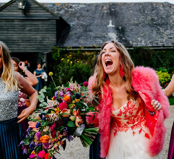 Bride in Red &amp; White Joanne Fleming Design Wedding Dress | Pink Faux Fur Jacket | Bridesmaids in Jewel Coloured Skirts &amp; Sequin Top Separates | Colourful Alternative Winter Wedding at Upwaltham Barns, Sussex | Epic Love Story Photography