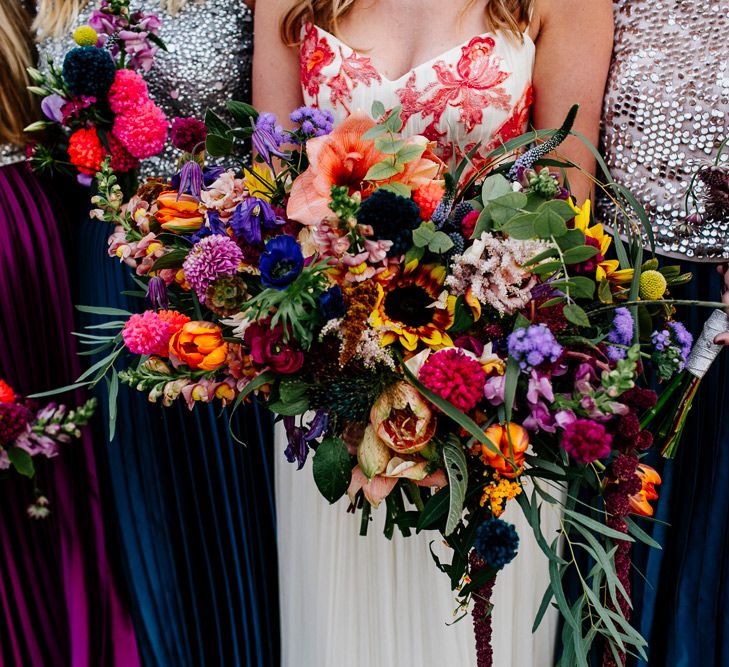 Oversized Bridal Bouquets | Bride in Red &amp; White Joanne Fleming Design Wedding Dress | Bridesmaids in Jewel Coloured Skirts &amp; Sequin Top Separates | Colourful Alternative Winter Wedding at Upwaltham Barns, Sussex | Epic Love Story Photography