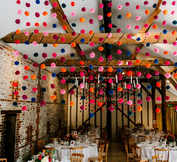 Hanging Pom Pom Wedding Decor | Colourful Alternative Winter Wedding at Upwaltham Barns, Sussex | Epic Love Story Photography