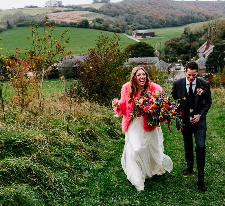 Bride in Red &amp; White Joanne Fleming Design Wedding Dress | Groom in Suit Supply Suit | Colourful Alternative Winter Wedding at Upwaltham Barns, Sussex | Epic Love Story Photography