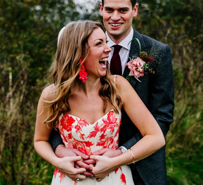 Bride in Red &amp; White Joanne Fleming Design Wedding Dress | Groom in Suit Supply Suit | Colourful Alternative Winter Wedding at Upwaltham Barns, Sussex | Epic Love Story Photography