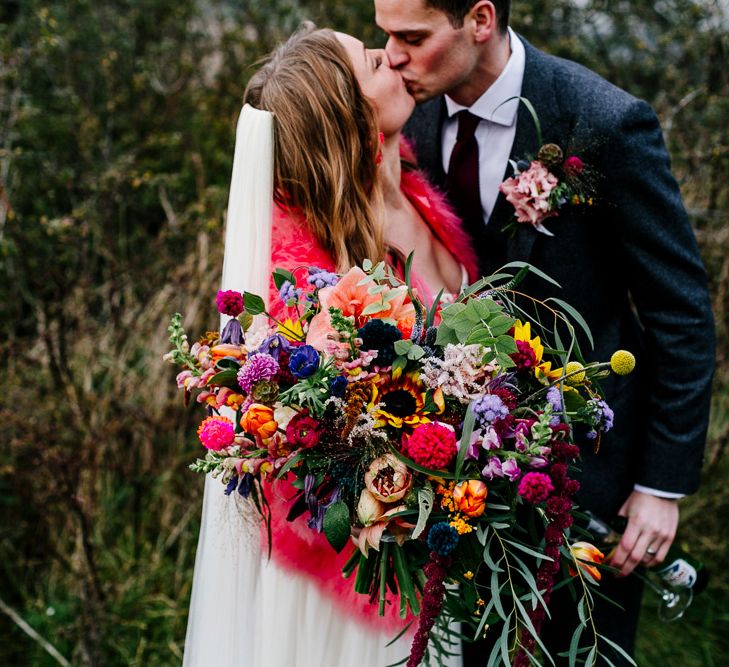 Oversized Bright Bouquets | Bride in Red &amp; White Joanne Fleming Design Wedding Dress | Groom in Suit Supply Suit | Colourful Alternative Winter Wedding at Upwaltham Barns, Sussex | Epic Love Story Photography