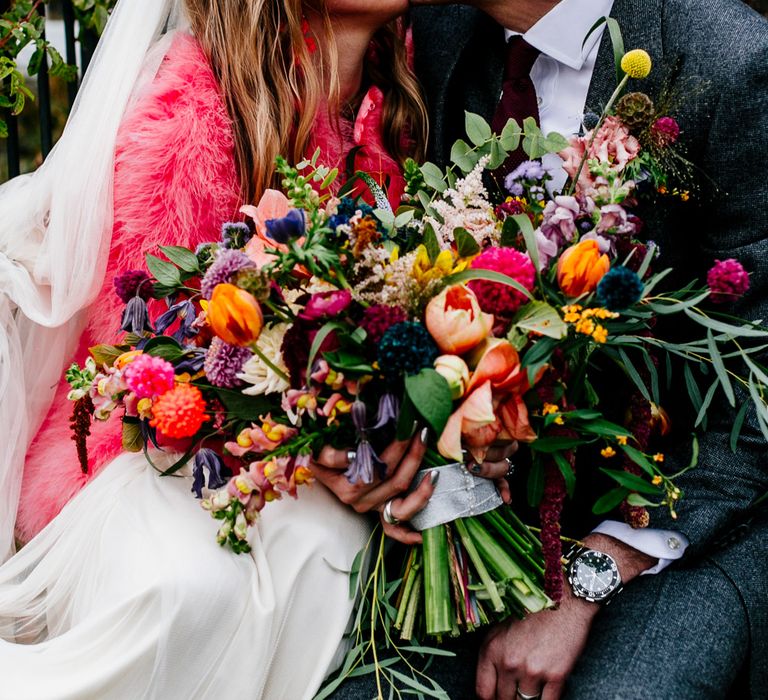 Oversized Colourful Bouquet | Bride in Red &amp; White Joanne Fleming Design Wedding Dress | Groom in Suit Supply Suit | Colourful Alternative Winter Wedding at Upwaltham Barns, Sussex | Epic Love Story Photography