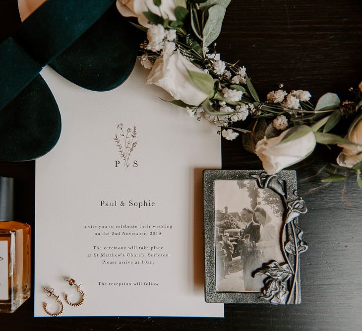 Wedding stationery and white floral crown at intimate celebration