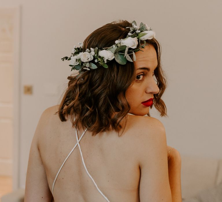 Back of brides Spell And The Gypsy dress with cross laced backed detailing and red lip