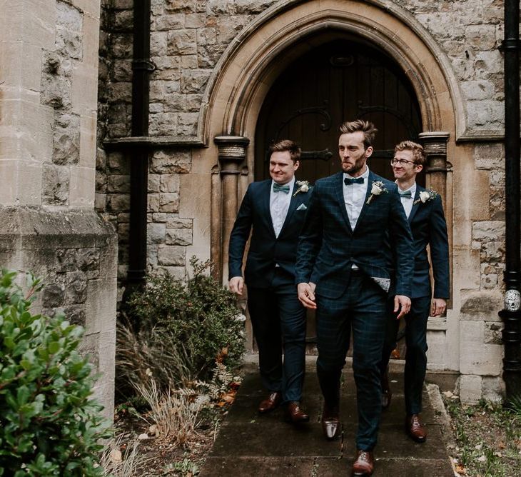 Groom and his groomsmen for intimate church ceremony