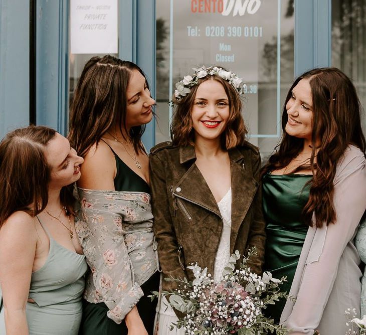 Intimate autumn wedding reception with boho bridal dress teamed with suede jacket and green bridesmaid dresses