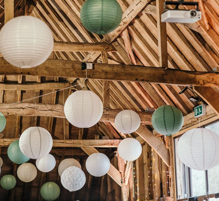 Hanging Paper Lanterns | Gold, Grey &amp; Green Rustic Wedding at The Gilbert White’s 16th Century Hampshire Barn | Joasis Photography