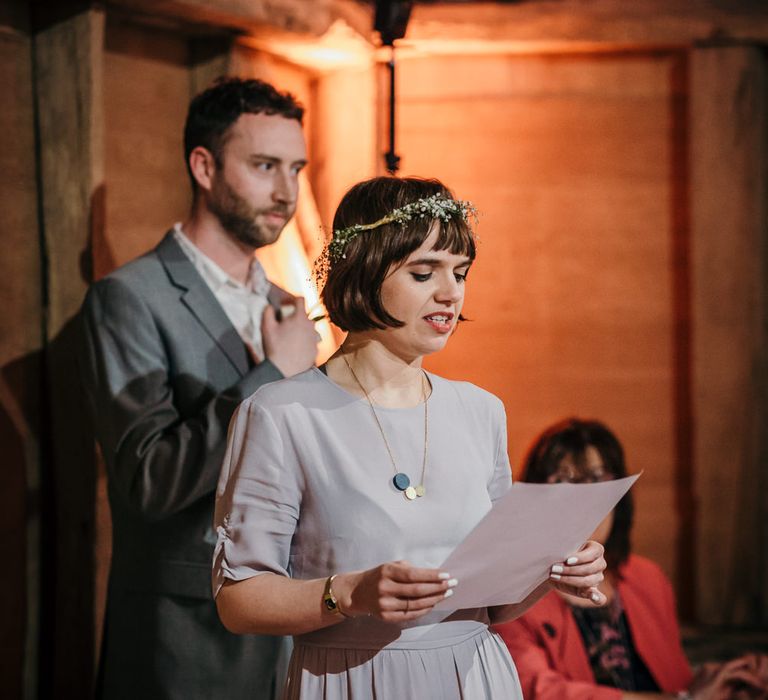 Wedding Ceremony | Bride in Essense of Australia Gown | Groom in  Grey Suit | Gold, Grey &amp; Green Rustic Wedding at The Gilbert White’s 16th Century Hampshire Barn | Joasis Photography