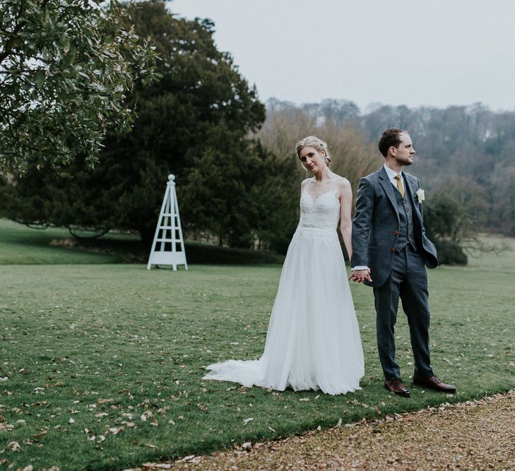 Bride in Essense of Australia Gown | Groom in  Grey Suit | Gold, Grey &amp; Green Rustic Wedding at The Gilbert White’s 16th Century Hampshire Barn | Joasis Photography