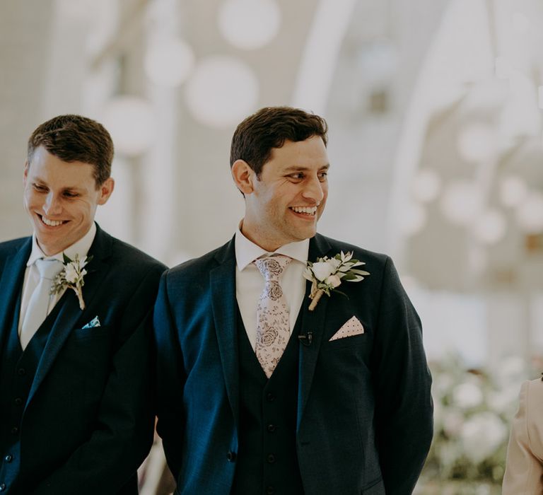 Groom waits for bride at Tithe Barn Petersfield wedding