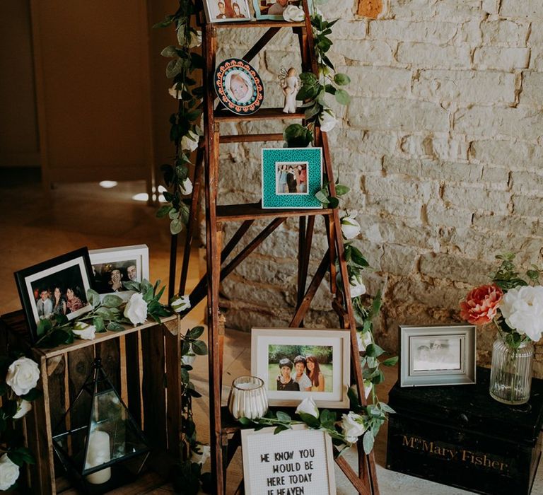 Rustic wedding decor with photo step ladder