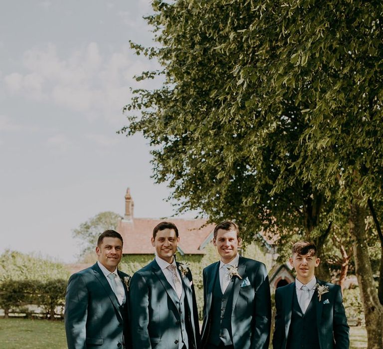 Groomsmen in matching wedding suits at Tithe Barn Petersfield wedding