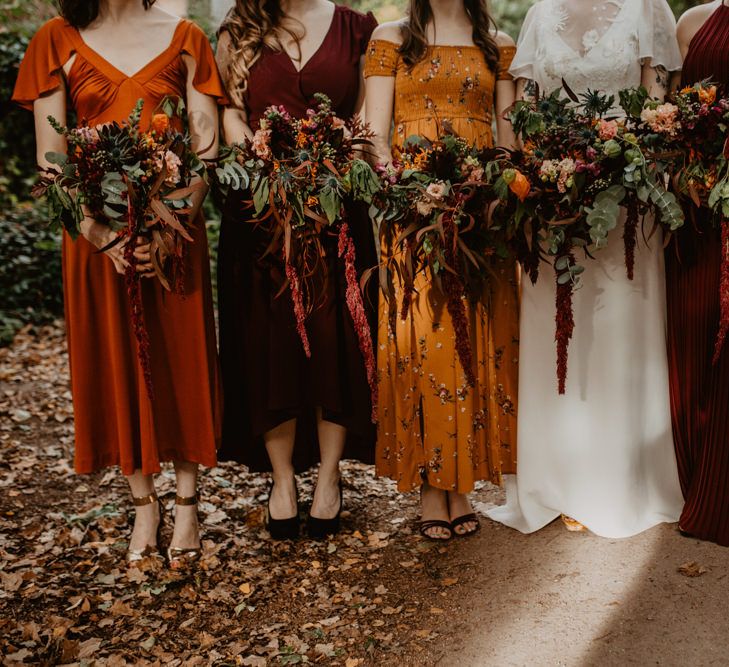 Large Bridal Party Bouquets with Orange and Red Flowers and Foliage