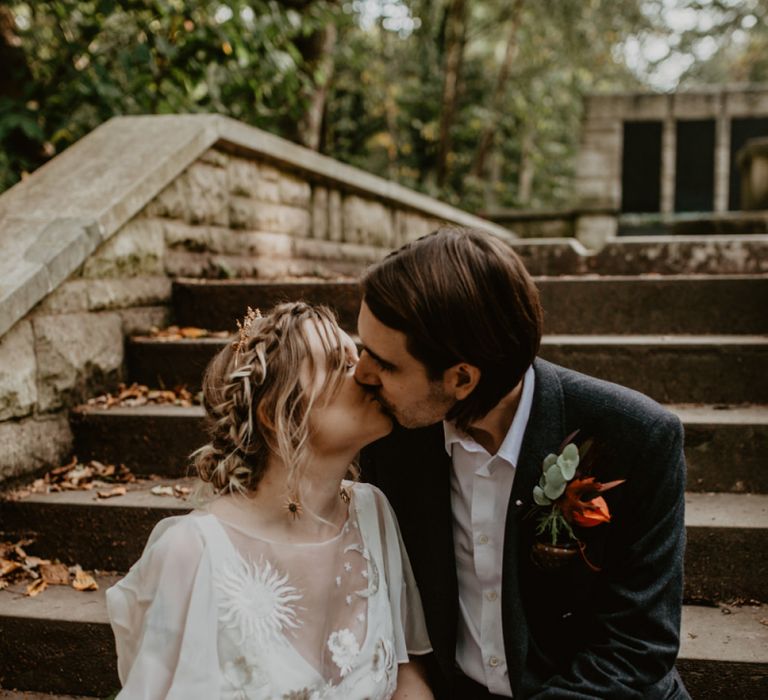 Bride and Groom Kissing on the Steps