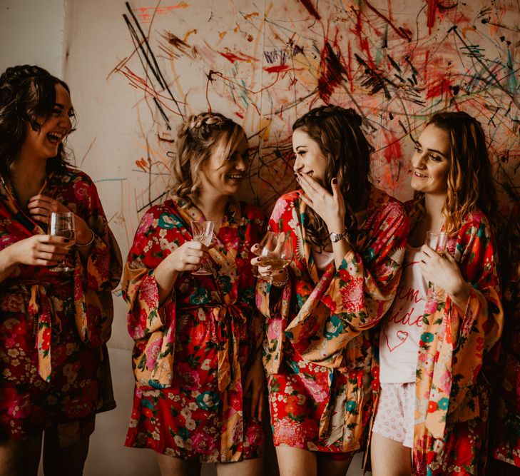 Wedding Morning Bridal Party Preparations in Matching Floral Getting Robes