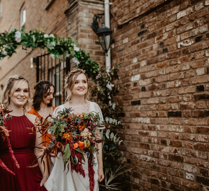 Bride and Bridesmaids with Large Bouquets with Cascading Flowers