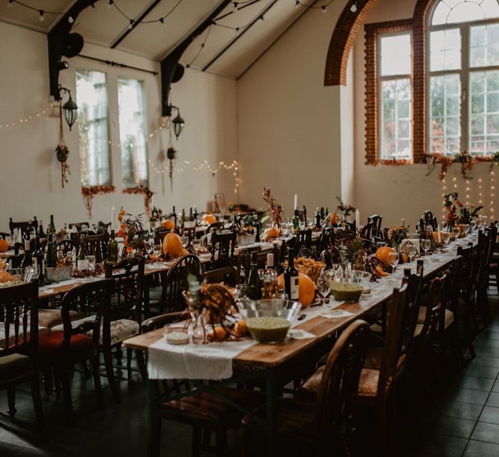 Autumnal Wedding Reception Decor with Fairy Lights and Pumpkins