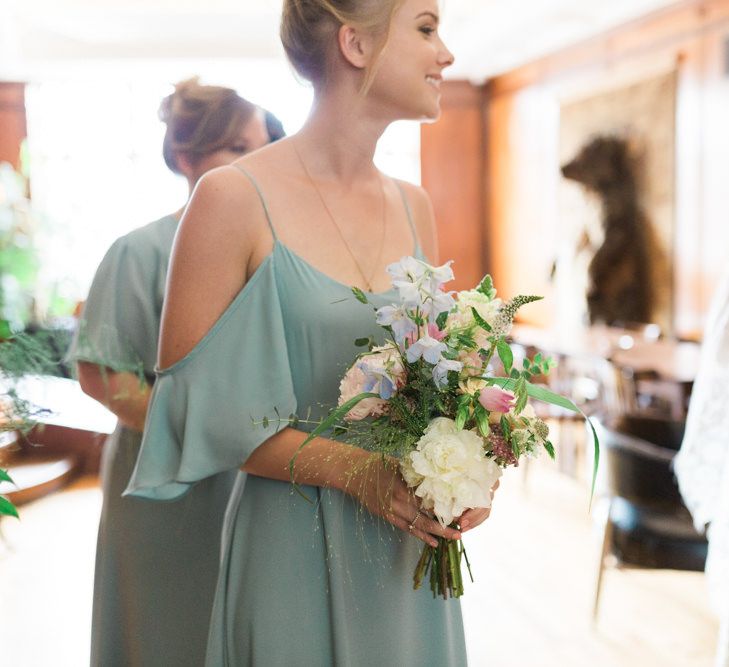 Bridesmaids in Mismatched Marine Green Rewritten Dresses | Pastel Wedding Bouquets | Neon Sign and Marine Green Rewritten Bridesmaids Dresses with Lace Cape Grace Loves Lace Gown | Alain Mbouche Photography