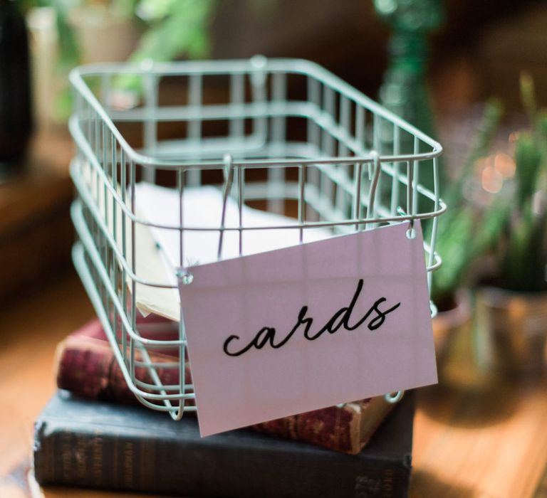 Green Metallic Wire Cards Box | Vintage Books Decor | Neon Sign and Marine Green Rewritten Bridesmaids Dresses with Lace Cape Grace Loves Lace Gown | Alain Mbouche Photography