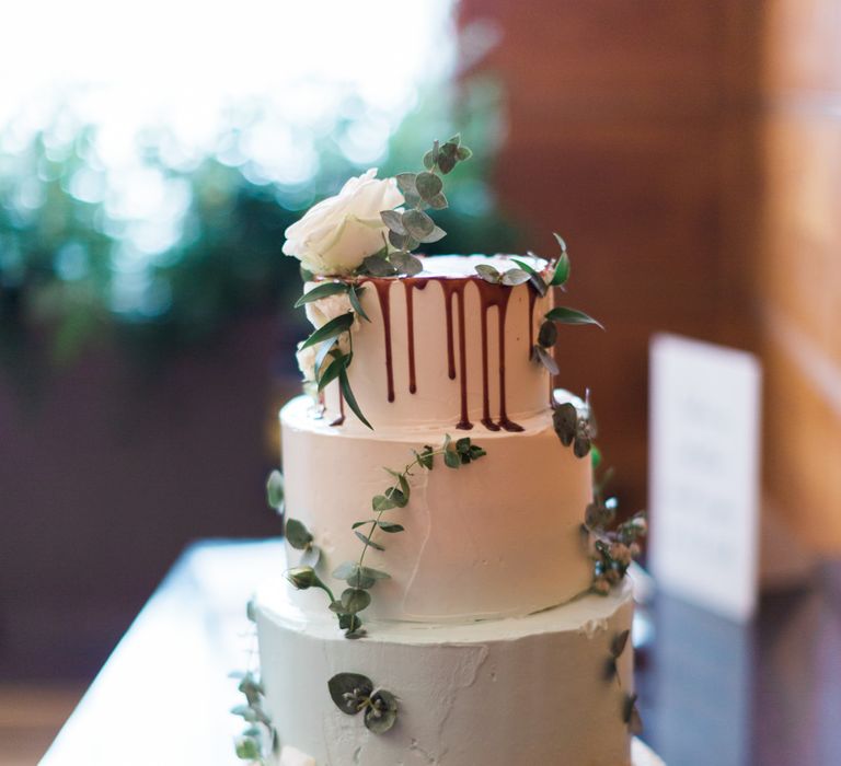 Four-Tier Wedding Cake by Lily Vanilli with Green and Gold Ombre Icing and Drippy Detail | Neon Sign and Marine Green Rewritten Bridesmaids Dresses with Lace Cape Grace Loves Lace Gown | Alain Mbouche Photography