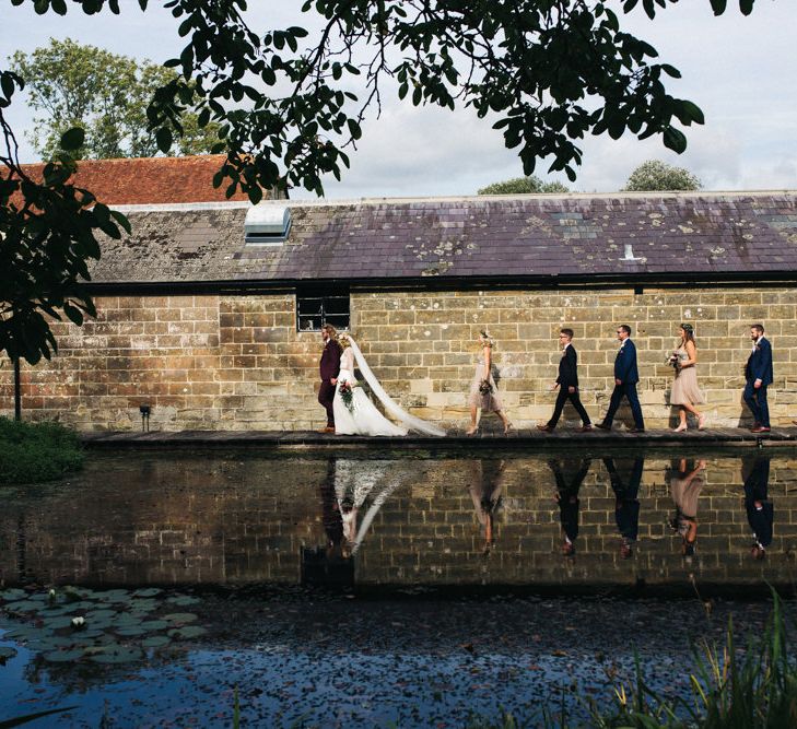 Wedding Party Walking by The River