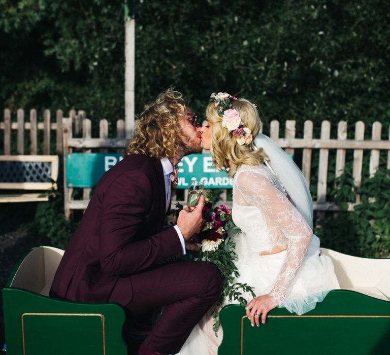 Bride and Groom Kissing on Miniature Railroad