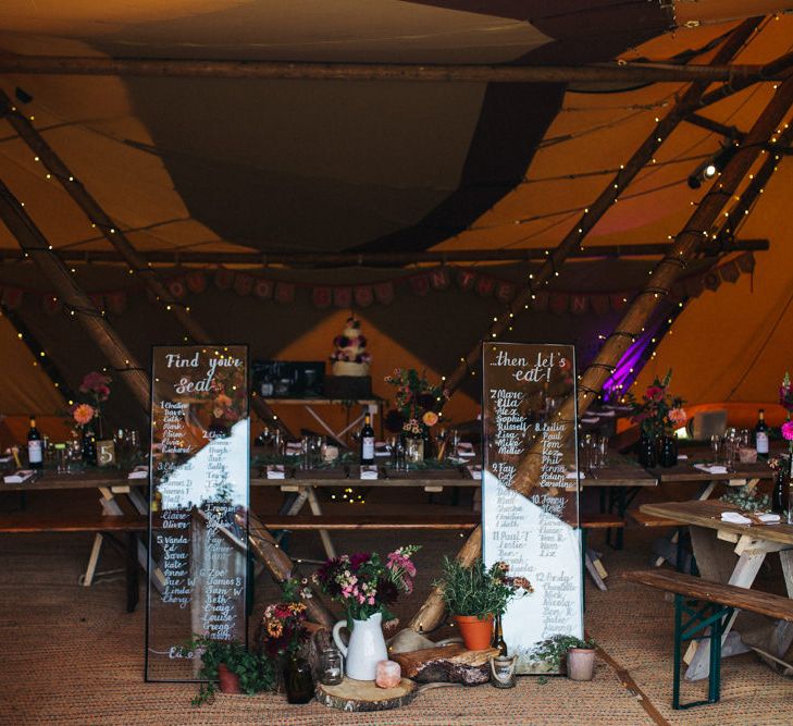 Wedding Decor of Window Pane Seating Chart with Calligraphy Writing, plus  Log Slices and Wild Flowers