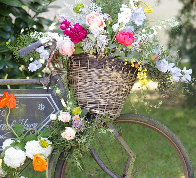 Vintage Bicycle With Wedding Flowers | Spring Wedding Colours for 2019 | Bold &amp; Bright Spring Wedding Inspiration by Helaina Storey Wedding Design | Flowers by Bloomologie | Palette Signs by Made by Wood &amp; Wood | Claire Graham Photography