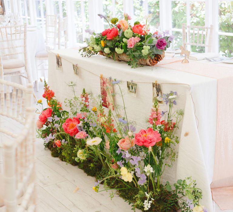 Top Table Wedding Floral Arrangement with Pink Peonies | Spring Wedding Colours for 2019 | Bold &amp; Bright Spring Wedding Inspiration by Helaina Storey Wedding Design | Flowers by Bloomologie | Palette Signs by Made by Wood &amp; Wood | Claire Graham Photography