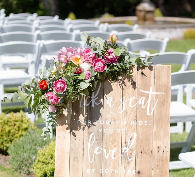 Wooden Palette Wedding Sign with Floral Decor | Spring Wedding Colours for 2019 | Bold &amp; Bright Spring Wedding Inspiration by Helaina Storey Wedding Design | Flowers by Bloomologie | Palette Signs by Made by Wood &amp; Wood | Claire Graham Photography