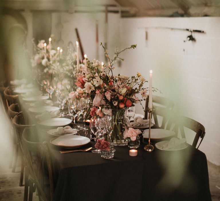 Boat House Wedding Reception With Pink Toned Florals And Ivory Tapered Candles // Images By James Frost Photography