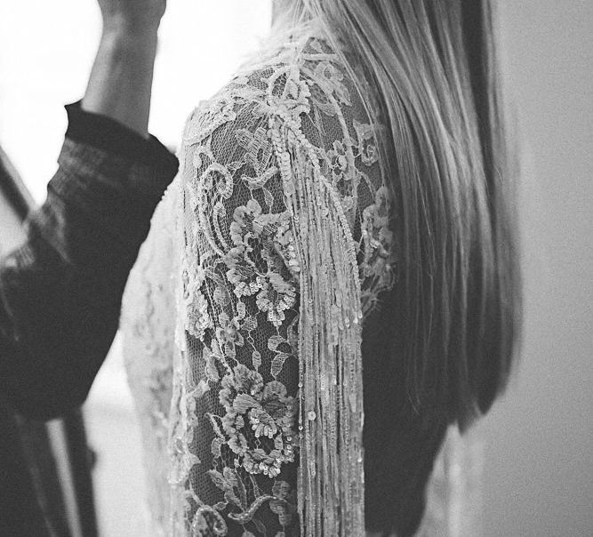 Back of lace and beaded boho bridal dress with tassel detailing