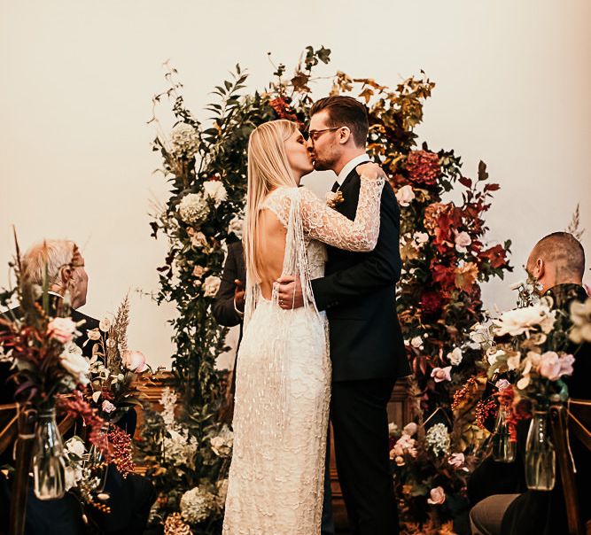 Bride and groom tie the knot at Clapton Country Club wedding ceremony with botanical styling