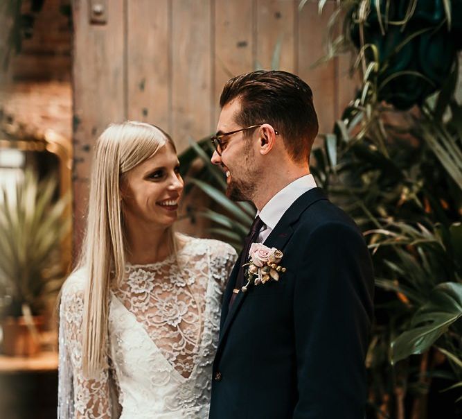 Bride wearing a lace and beaded boho style dress