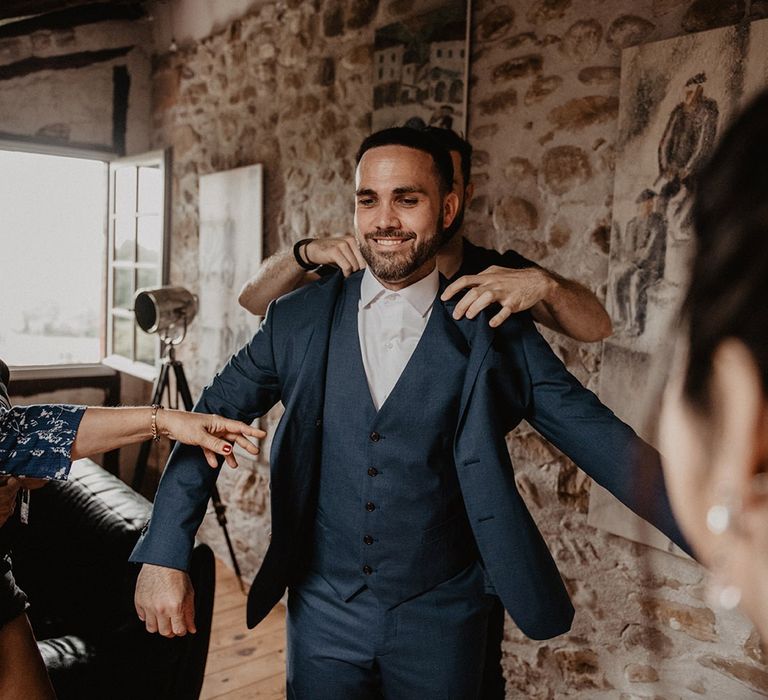 Grooms bow ties and wedding suits