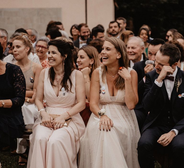 Wedding guests enjoy outdoor ceremony