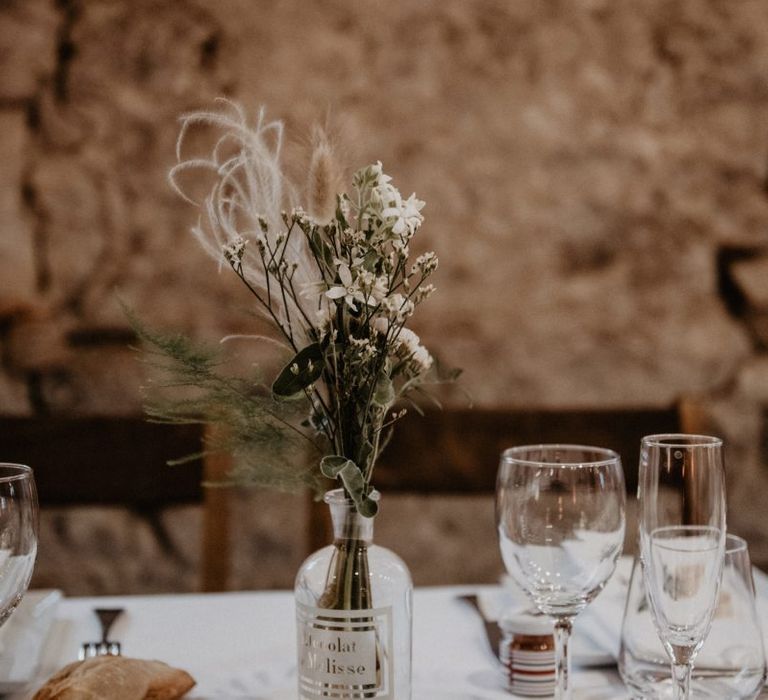 Wedding table decor with dried flowers and grooms bow ties