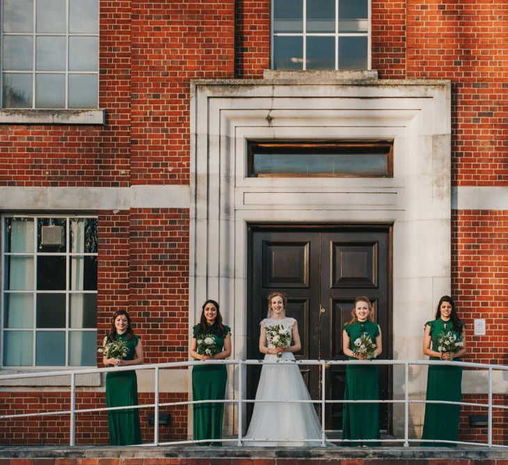 Bride and Bridesmaids in ASOS Green Dresses Outside The West Reservoir Centre, Stoke Newington // Images by Remain In Light